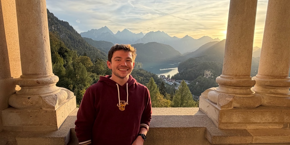 Anthony at sunset on a castle terrace overlooking the mountains near Schwangau